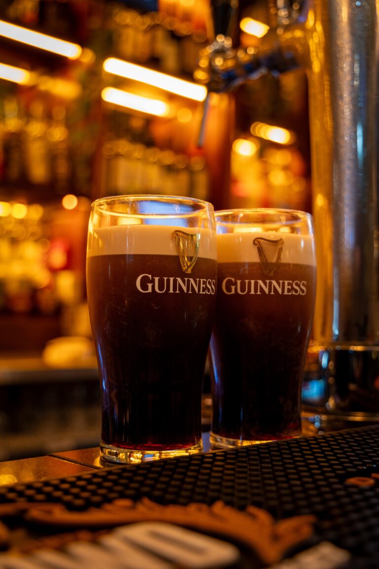 Two pints of Guinness on pub bar