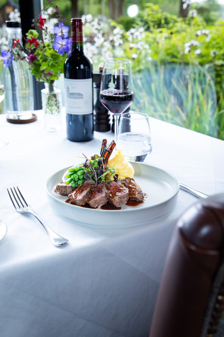 Plated chops with vegetables and red wine
