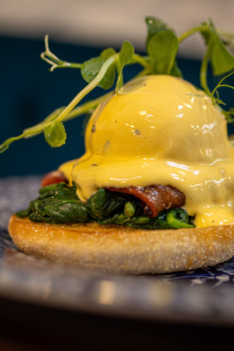 Eggs Benedict with spinach, bacon and hollandaise